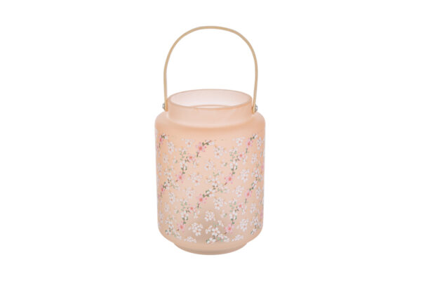 Lanterna in vetro Magnolia rosa chiaro con decorazione floreale, dimensioni d.12 x h.17 cm, manico dorato e shopper inclusa.