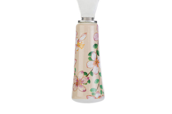Apribottiglie Magnolia 12 cm con astuccio, manico decorato con fiori di magnolia rosa su sfondo beige.